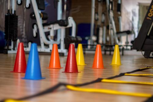 a row of colored cones sitting on a wooden floor at Grande Hotel da Barra in Salvador