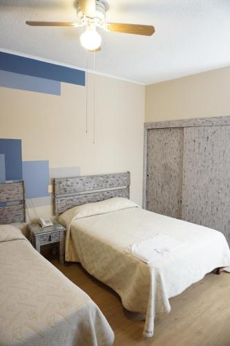 Кровать или кровати в номере Hotel Palacio