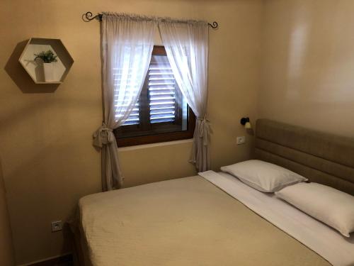 Кровать или кровати в номере Apartments Monte Green