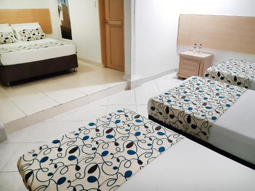 Кровать или кровати в номере Hotel Plaza 43