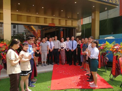 a group of people standing on a red carpet at PACI Hotel&SPA in Sihanoukville