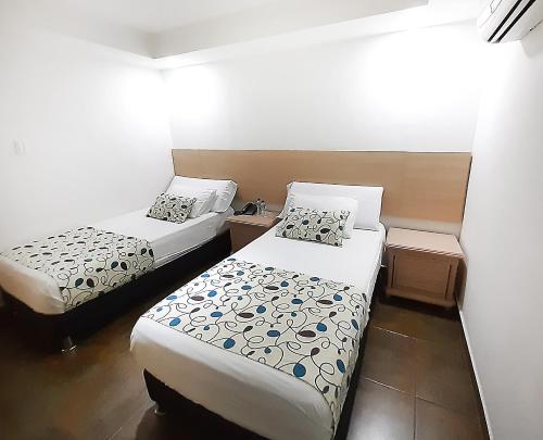 Кровать или кровати в номере Hotel Plaza 43