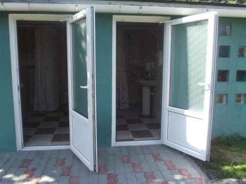 an open french door on a house at House in the Garden in Pärnu