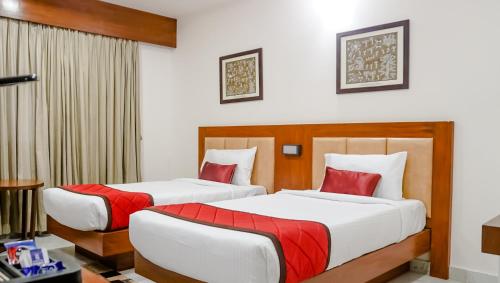 Кровать или кровати в номере The Altruist Business Hotel Navi Mumbai-1