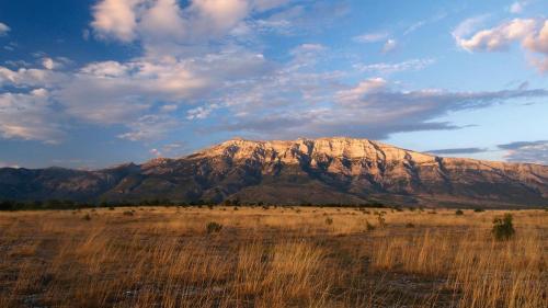 a large mountain in the middle of a field at Guest house Slatki Snovi in Knin