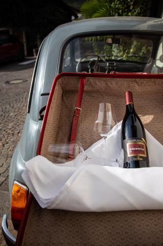 a bottle of wine in the back of a car at Romantik Hotel Oberwirt in Marlengo