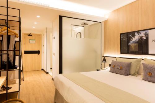 Katil atau katil-katil dalam bilik di Ars Magna Bleisure Hotel