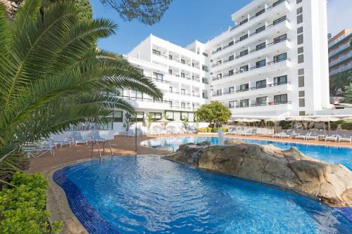 a view of the hotel from the pool at Ona Palmira Paguera in Paguera