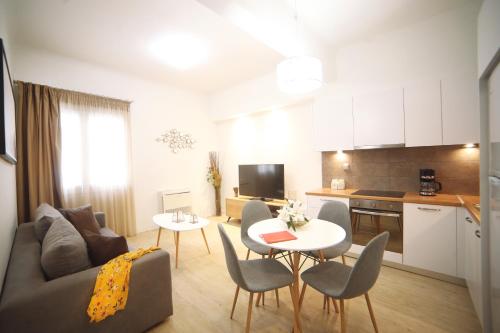 a living room with a couch and a table at Morum Athens Urban Stay in Athens