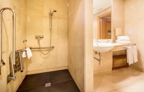 a bathroom with a sink and a shower at Ilunion Pio XII in Madrid