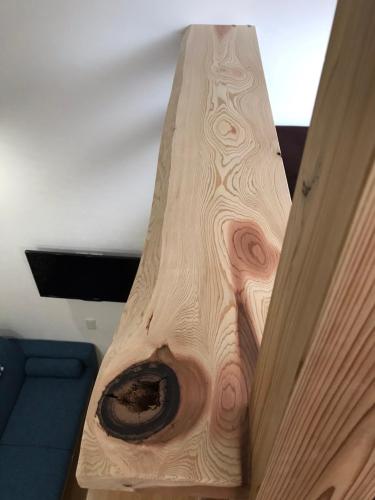 a wooden table with a hole in it at Stay Nikko Guesthouse in Nikko