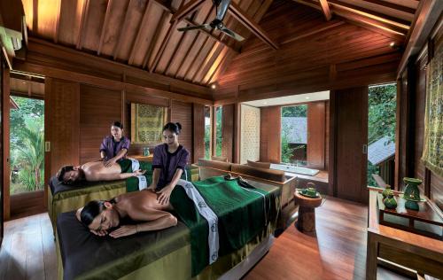 a group of people in a room with beds at Banyan Tree Bintan in Lagoi