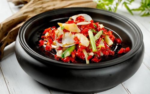 a black bowl filled with food on a table at City Hotel Xiamen-Free Welcome Fruits in Xiamen