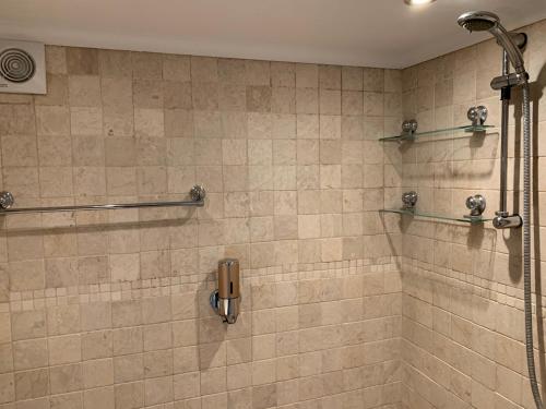 a bathroom with a shower stall with a shower at MyCityHaven South Parade Mansions in Bristol