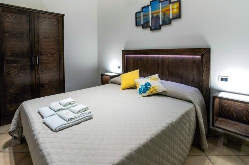 Postel nebo postele na pokoji v ubytování Perla di Mare Appartamenti
