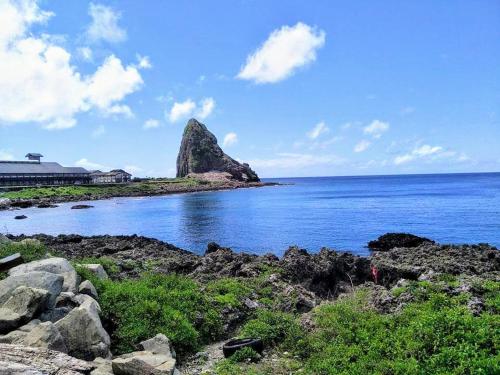 a rock formation in the middle of the ocean at 蘭嶼小島觀海旅宿 in Lanyu