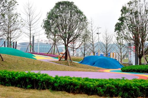 a park with a playground with a rainbow at Lavande Hotels·Guiyaung North Railway Station in Guiyang