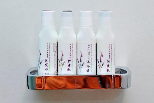 a container with four bottles of milk in it at Lavande Hotels·Guiyaung North Railway Station in Guiyang