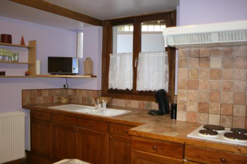 a kitchen with a sink and a counter top at Casa Andres in Malmedy