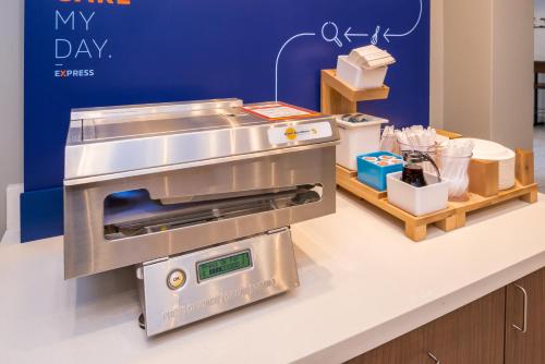 a restaurant counter with a cash register in a store at Holiday Inn Express Sierra Vista by IHG in Sierra Vista