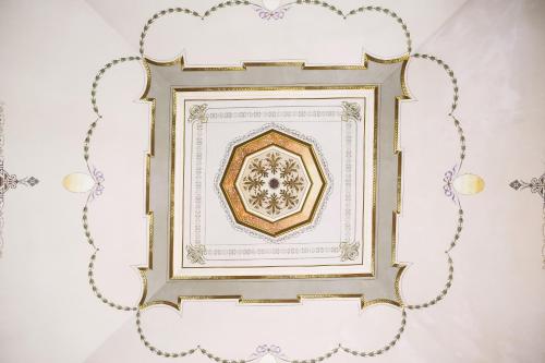 a gold picture frame hanging on a wall at Masseria D'Erchia in Monopoli