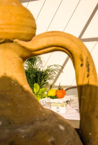 a banana sitting on top of a table with vegetables at Masseria D'Erchia in Monopoli
