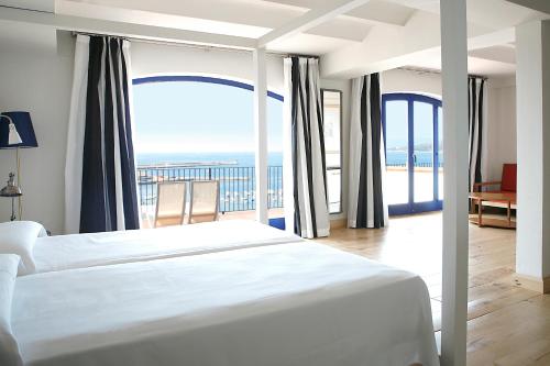 Postel nebo postele na pokoji v ubytování Hotel Trias