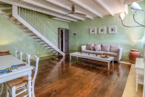 a living room with a couch and a table at Villa Cassia di Baccano in San Giustino Valdarno