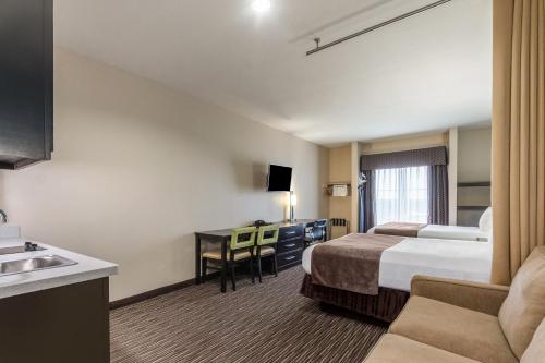 Postel nebo postele na pokoji v ubytování Residency Suites