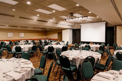 a large room filled with tables and chairs at Forest Park Hotel in Jasper