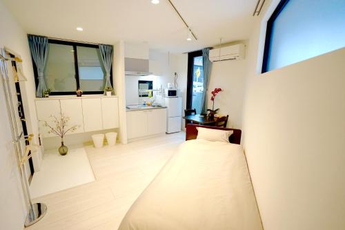 เตียงในห้องที่ Court Residence Tokyo Nakano