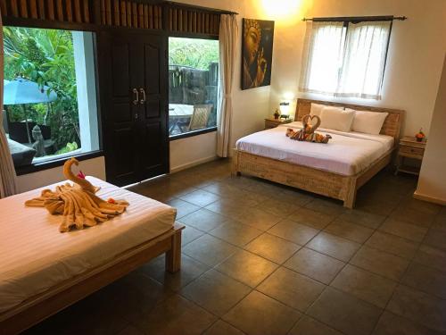 Cama o camas de una habitación en Junjungan Suite