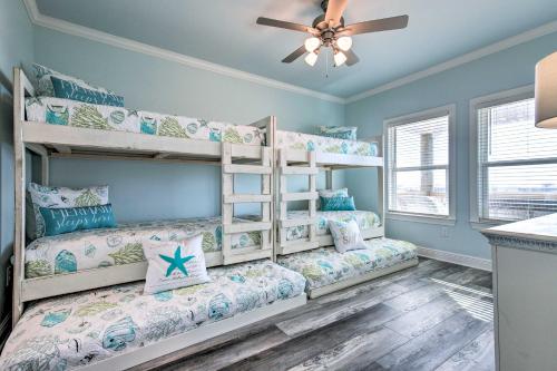 a bedroom with bunk beds in a house at Luxe Spacious Stilted Home with Kayaks Walk to Beach in Dauphin Island