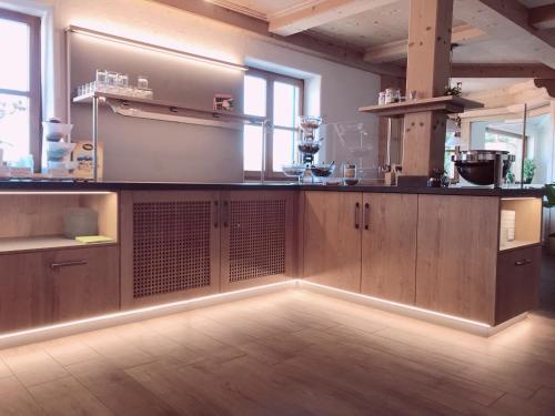 a kitchen with a large counter in a room at Hotel am Wiesenhang - Garni in Bad Kohlgrub