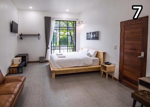 מיטה או מיטות בחדר ב-Na Klongluang Boutique Resort