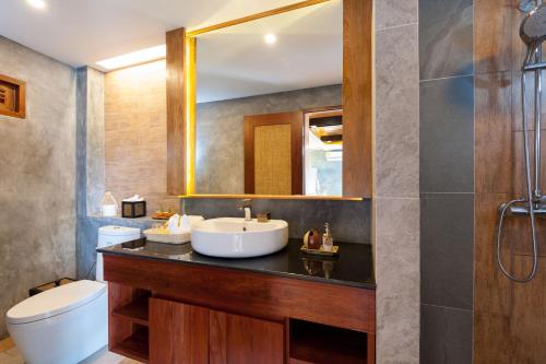 a bathroom with a sink and a mirror at View Point Resort in Koh Tao