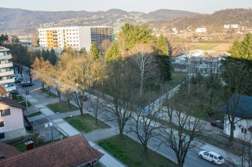 an aerial view of a city with trees and a street at Stan na dan Doboj in Doboj