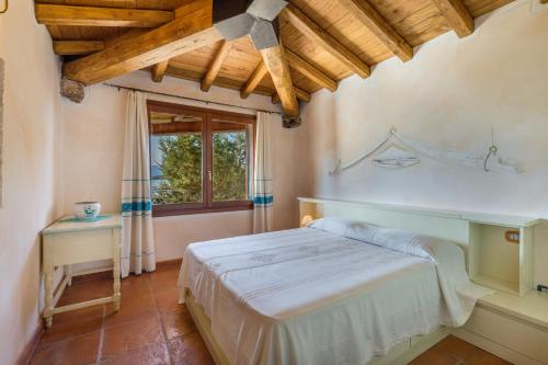 Postel nebo postele na pokoji v ubytování Villa Danza dei Fenicotteri