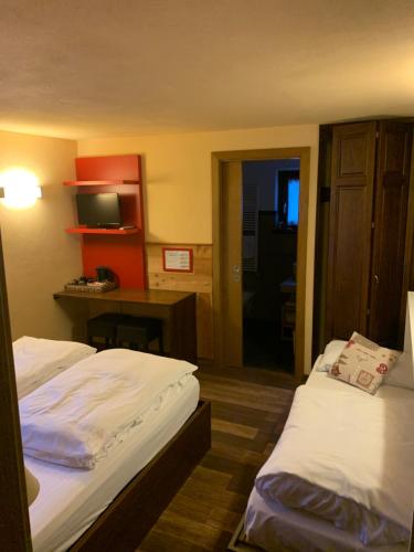 Säng eller sängar i ett rum på Hosquet Lodge