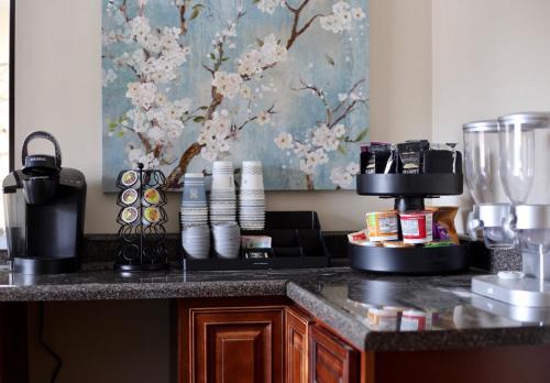 a kitchen with a counter with a coffee maker on it at Pine Mountain Inn in Pineville