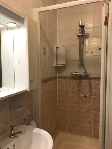 a bathroom with a sink and a shower at Ros Dún House in Donegal