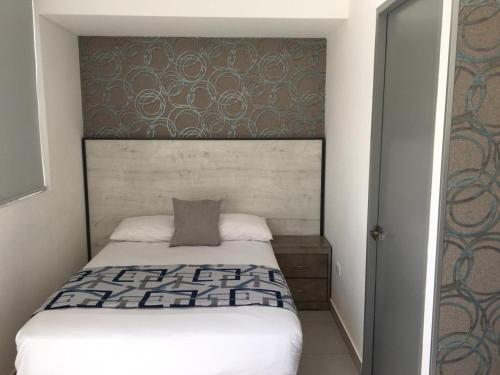 Cama o camas de una habitación en Suites André Confort Ejecutivo