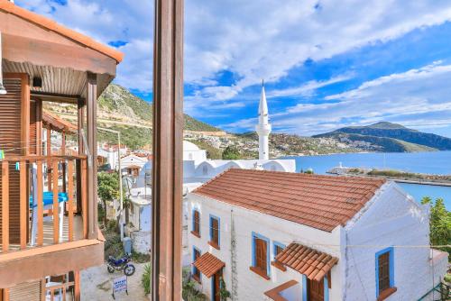 a view of a town with a church at Zinbad Hotel Kalkan in Kalkan