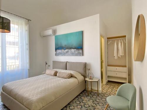 Tempat tidur dalam kamar di B&B Palazzo Corselli