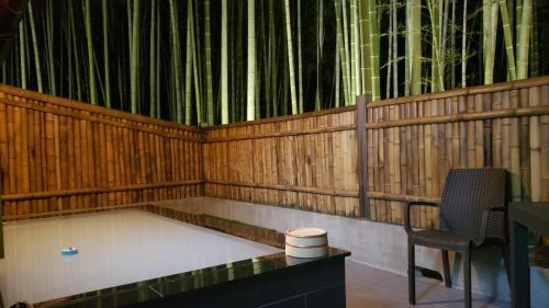 an empty stage with a chair and a organ at あかがね荘 in Sumino
