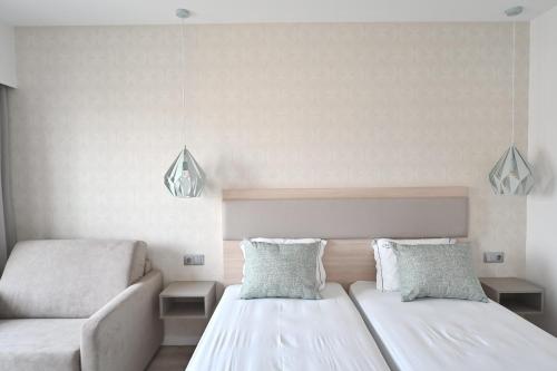My Charm Lisbon Suitesにあるベッド