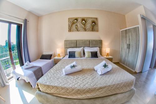 Ένα ή περισσότερα κρεβάτια σε δωμάτιο στο Costas apartments