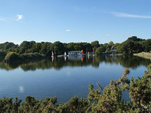a large lake with boats in the middle of it at Auplands en-suite Rooms in Lymington
