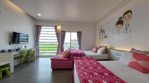 a bedroom with two beds and a couch and a desk at ChaoPingJia Fengge Guesthouse in Wujie