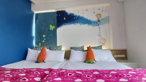 a bedroom with two beds with colorful pillows at ChaoPingJia Fengge Guesthouse in Wujie